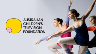 Three ballet dancers, dressed in colorful leotards and tights, perform elegantly against a plain backdrop. To the left, a yellow logo with a pig's face and the text "AUSTRALIAN CHILDREN'S TELEVISION FOUNDATION" is displayed prominently.